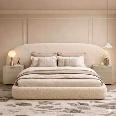 Beige upholstered platform bed with curved headboard