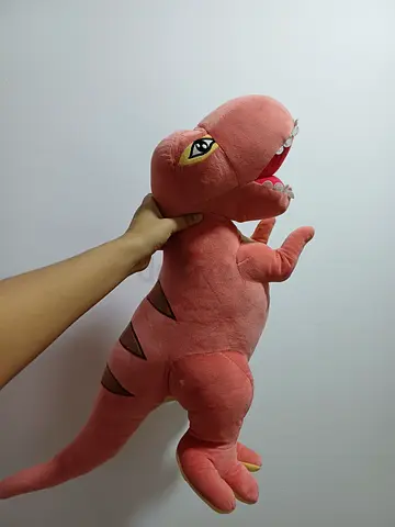 Large soft pink dinosaur plush toy - gently used