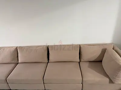 Beige Sofa - Comfortable 4-seater Section. Very lightweight and in very good condition. 4 pieces