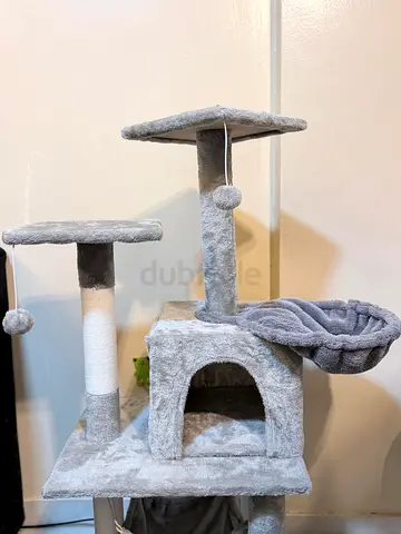 Gray multi-level cat tree with condo, hammock and scratching posts
