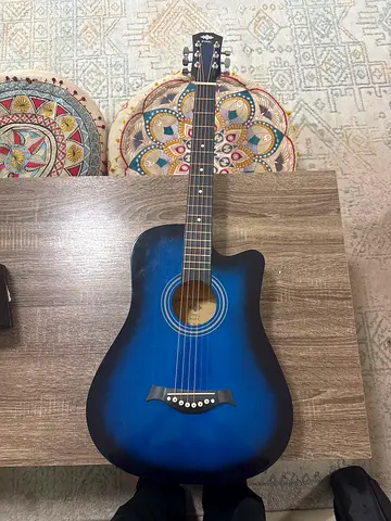 Blue acoustic guitar with original BAG