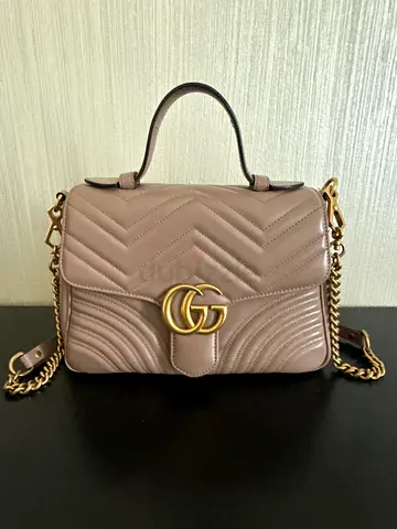 Beige quilted leather shoulder bag with gold chain strap
