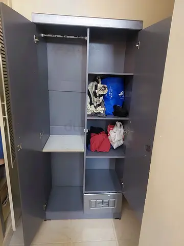 Used grey wardrobe / armoire with shelves and hanging space