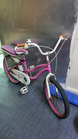 Kids pink 18-inch bicycle with training wheels included
