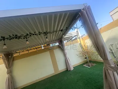 Outdoor pergola with retractable roof and curtains - great condition 10 months old. 3x2x2.5m