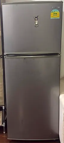 Compact single-door refrigerator with top freezer - used, good condition
