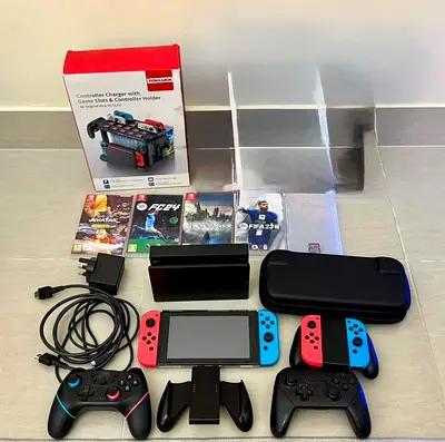 Nintendo Switch console + accessories, controllers, games, case, charging station