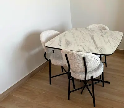 Small marble-top dining table with 3 boucle chairs - compact set