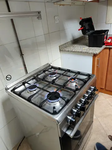 Stainless Steel 4-Burner Gas Cooker with Oven - Good Working Condition