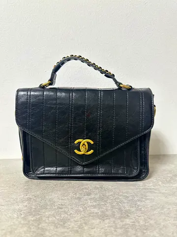 Vintage black Chanel STYLE CC leather top-handle bag