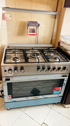 Stainless Steel 5-Burner Gas Range with Built-in Oven - Good Condition