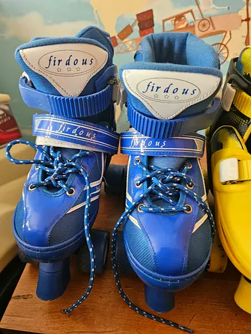 Blue adjustable kids roller skates - size not specified, lightly used
