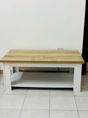 Simple wooden tv unit with lower shelf