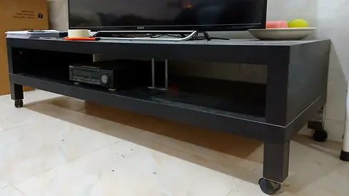 TV stand/entertainment unit on wheels, Sturdy Wooden IKEA Quality - Good condition. Black Color.