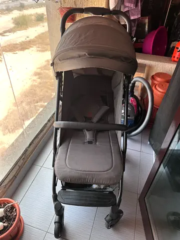 Stroller with carrier sling