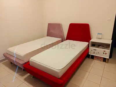 Pair of Single Beds with Velvet Headboards + both mattress included. 600 aed for all