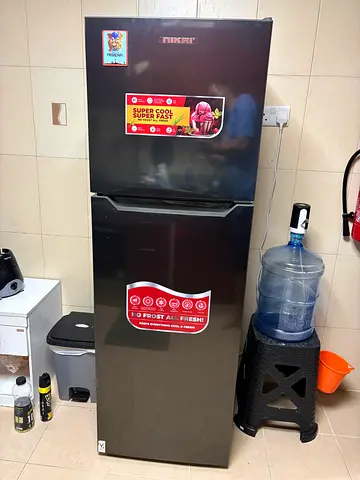 2 months old Nikai double-door refrigerator in excellent working condition with warranty