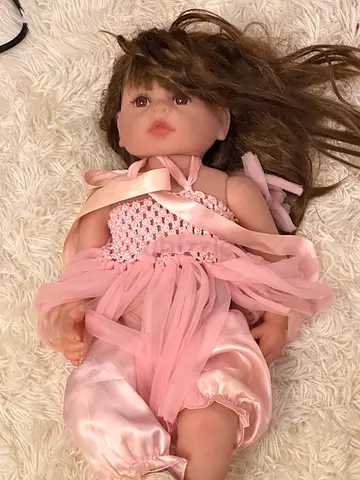 Large realistic baby doll in pink dress - excellent condition