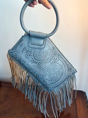 Grey leather fringe handbag with circular handle