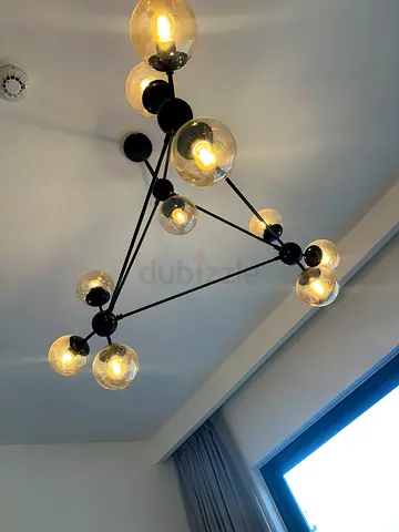 Modern black metal chandelier with glass globe bulbs - great condition