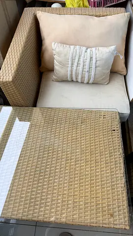 Beige Rattan Outdoor Sofa Chair with Cushions and Matching Table