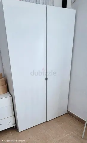 White two-door wardrobe / armoire in good condition