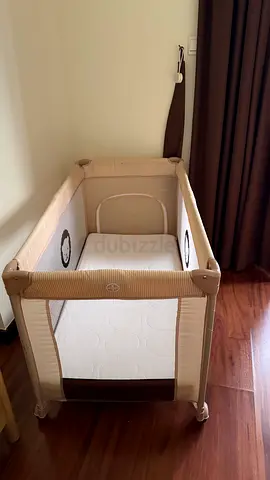 Light beige portable baby playpen / travel cot in good condition