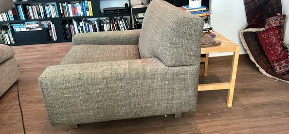 Large single sofa armchair in grey woven fabric - Excellent condition. Original price 2500 AED
