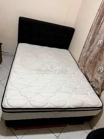 Queen size bed with mattress and upholstered headboard - good condition