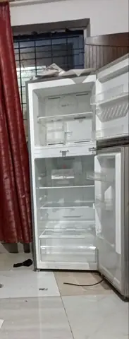 Used white top-freezer refrigerator - good working condition