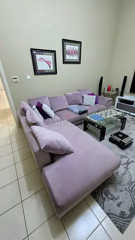 Light mauve L-shaped sofa with chaise - good condition