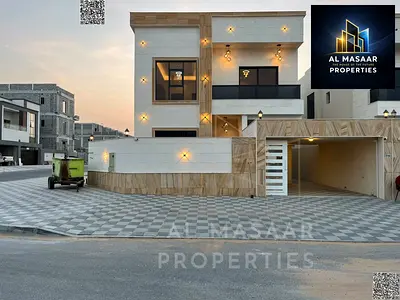For Sale: Villa including registration fees in Al Helio 2 Ajman, 5 master bedrooms, majlis, living room, maid's room, two equipped kitchens, central a