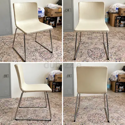 Set of 2 cream faux-leather dining chairs with chrome sled legs four piece available