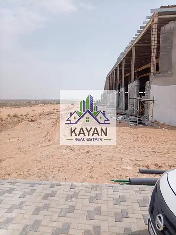 11,948 sq.ft investment land in UAQ, road access, ideal for warehouses & labour accommodation, 20 y