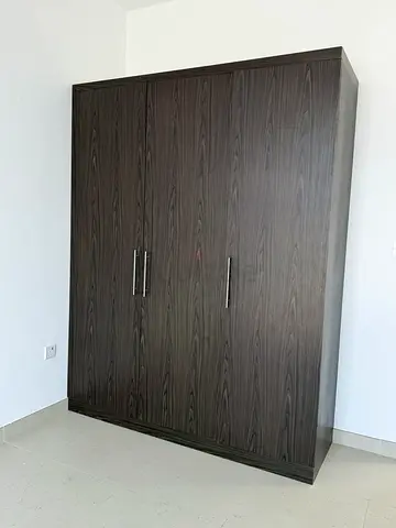 Dark wood 3-door wardrobe / armoire in good condition