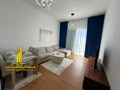 Luxury apartment, first occupancy, one bedroom and living room with an open balcony. Ajman Corniche.