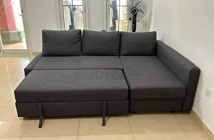 Dark grey L-shaped convertible sofa bed - compact corner sofa