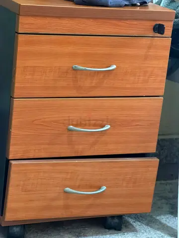 wooden 3-drawer storage cabinet on wheels