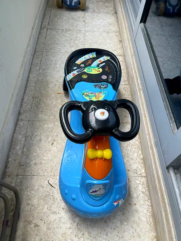 Blue Ride-On Toddler Car with Steering Wheel and Sound Panel