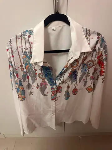 White women's blouse with feather print, size L