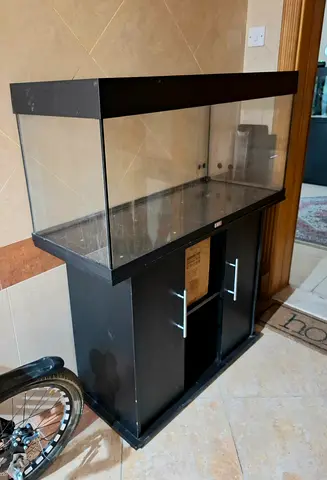 Large glass aquarium tank with black stand — used, good condition no filter and light.
