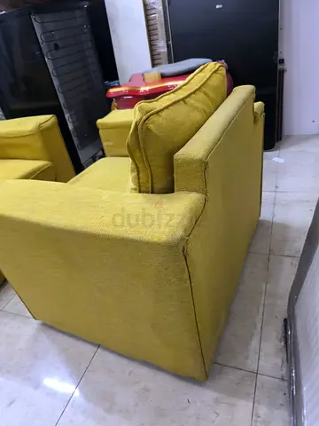Used 2-seater mustard green sofa - sturdy frame, good condition