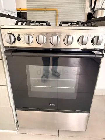 Used freestanding stainless steel gas range with oven - good working condition