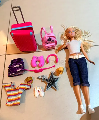 Barbie doll with travel accessories, clothes and carry-on luggage
