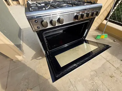 2 free standing cooking range and 1 wash machine