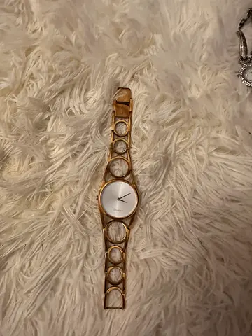 CK Gold-tone women's fashion bracelet watch, minimal dial