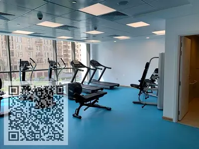 For sale: Two-bedroom apartment with living room in Al Waha Tower, including parking, furniture, gym, and swimming pool inside the tower.