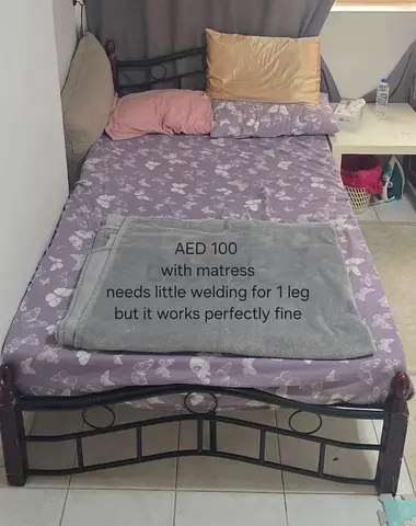 Single metal bed frame with mattress - AED 100 (needs minor welding)