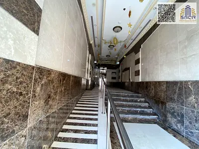 For rent in Sharjah, Al Qulaya area: a distinctive apartment consisting of two bedrooms, a living room, and two bathrooms.