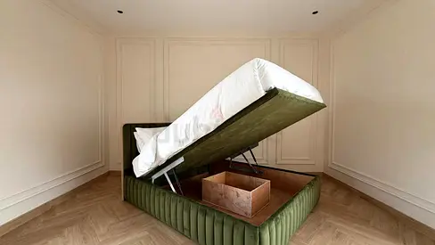 Green upholstered ottoman bed with gas-lift storage - Queen